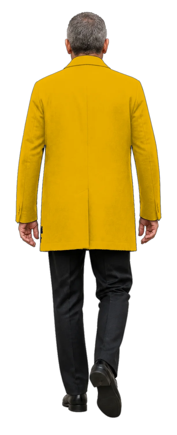 A man in a yellow coat walking away